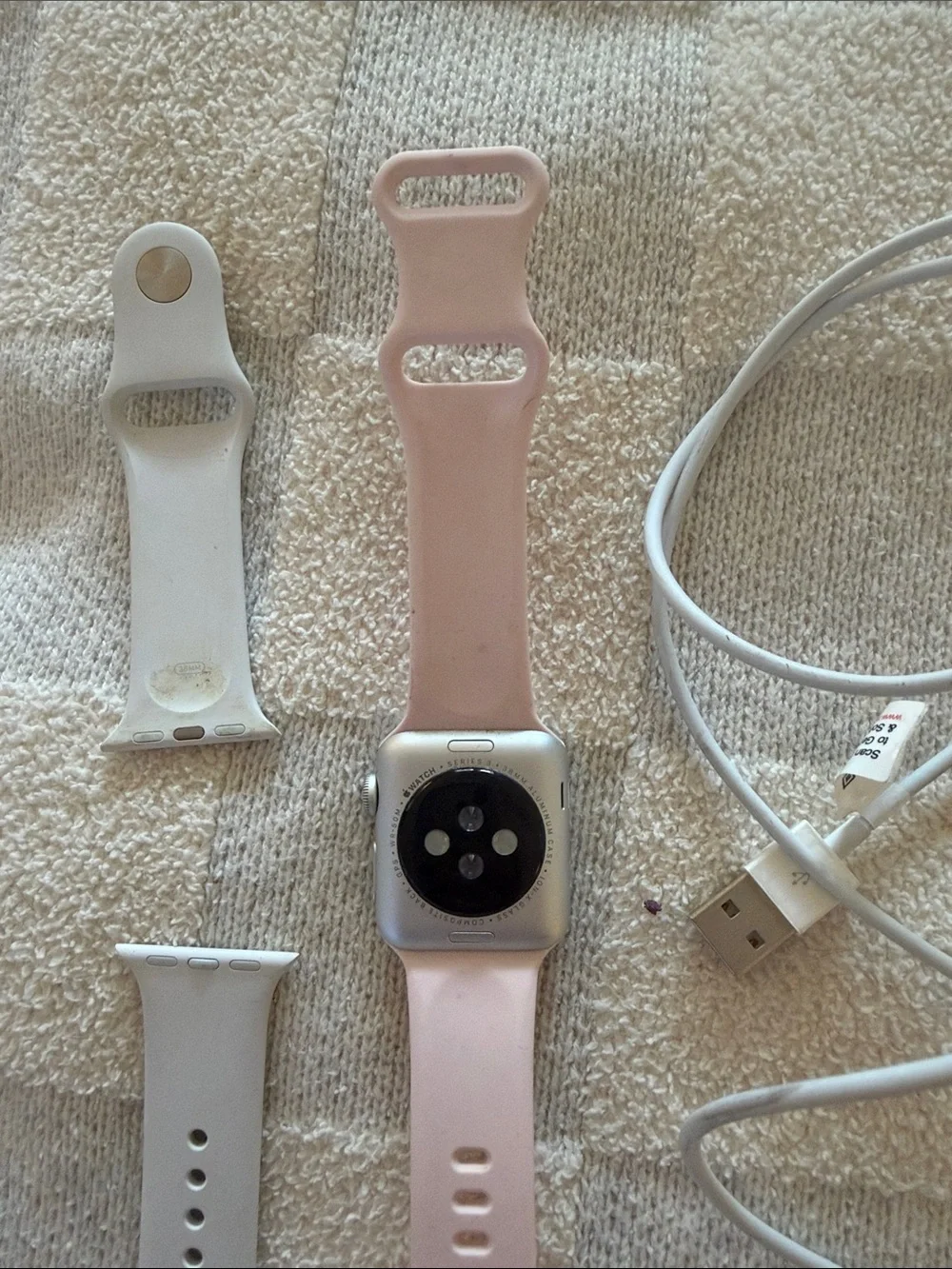 Apple Watch Series 3 complete with white and pink silicone bands and charger!